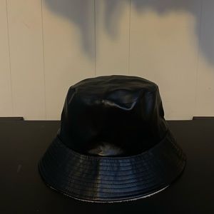 Reversible black and cream faux leather bucket hat